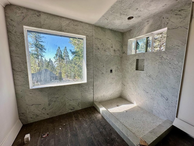 full bath with a stall shower and wood-type flooring