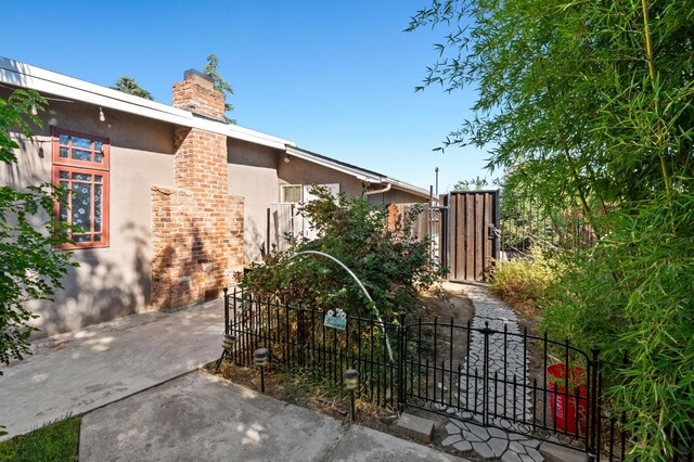 view of gate featuring fence