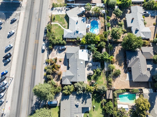 birds eye view of property with a residential view