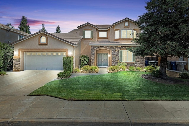 2729 Goshen Ave, Clovis, CA 93611 - traditional-style house with driveway, a garage, a lawn, stone siding, and stucco siding