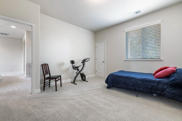 carpeted bedroom with baseboards and visible vents