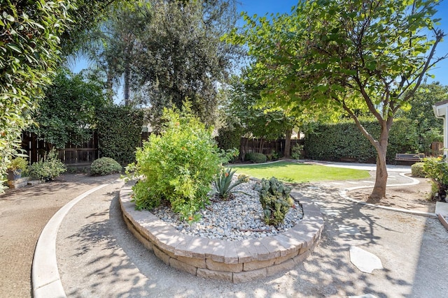 surrounding community featuring a lawn and fence