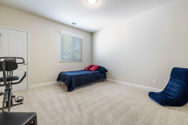 bedroom featuring carpet floors, visible vents, and baseboards