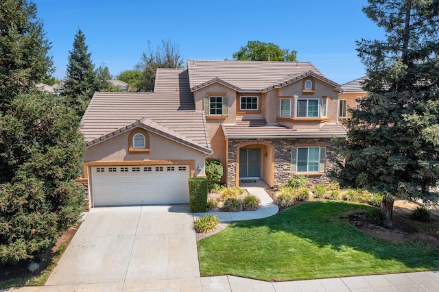 traditional-style house featuring an attached garage, stone siding, concrete driveway, a tiled roof, and a front yard