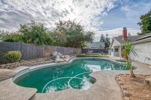 view of pool with a fenced backyard, a fenced in pool, and a patio