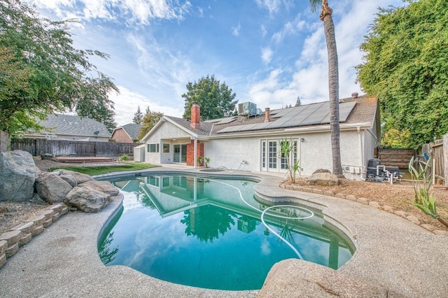 view of pool featuring a fenced in pool, a patio area, french doors, and a fenced backyard