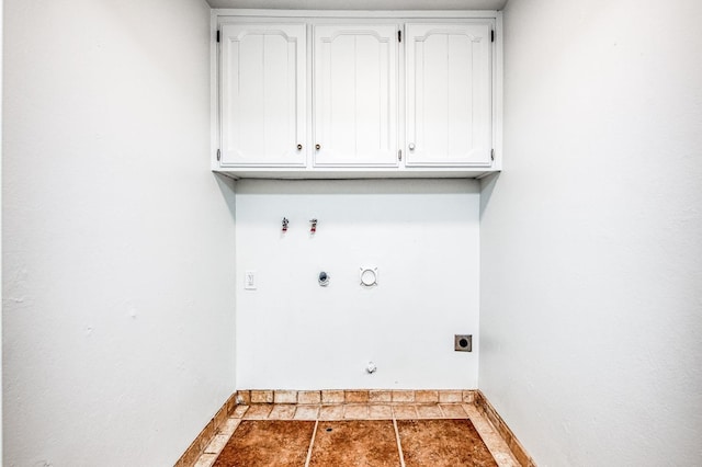 laundry area featuring baseboards, gas dryer hookup, tile patterned floors, and hookup for an electric dryer