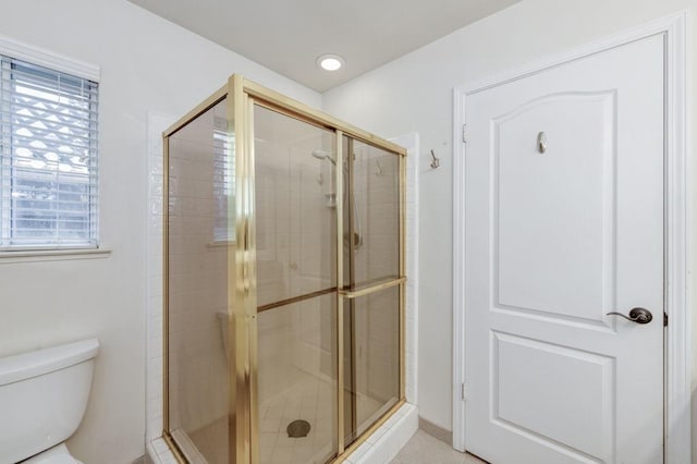 full bath featuring a stall shower, toilet, and recessed lighting