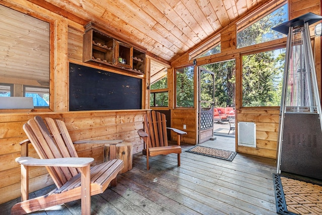 sunroom featuring wooden ceiling and vaulted ceiling