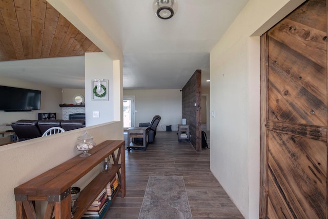 corridor with dark wood-style floors