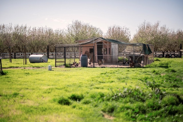 view of yard with an outdoor structure and exterior structure