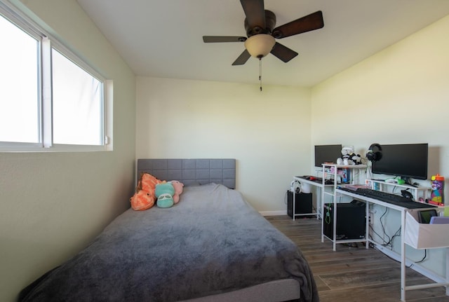 bedroom with ceiling fan and wood finished floors