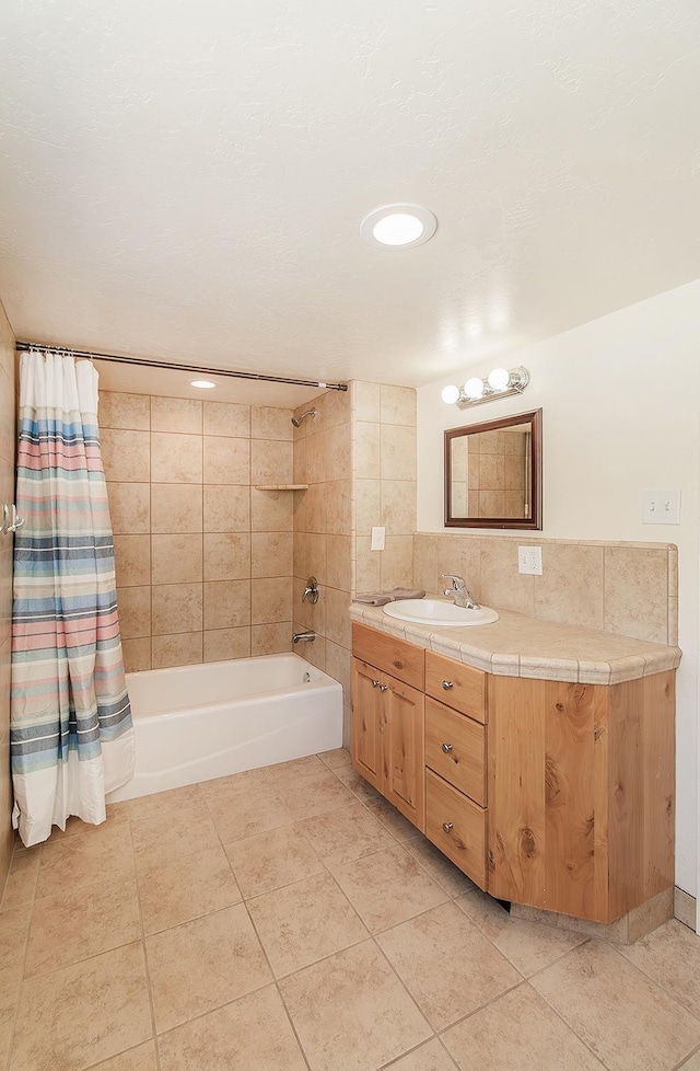 full bath with tile patterned floors, backsplash, shower / bath combination with curtain, and vanity