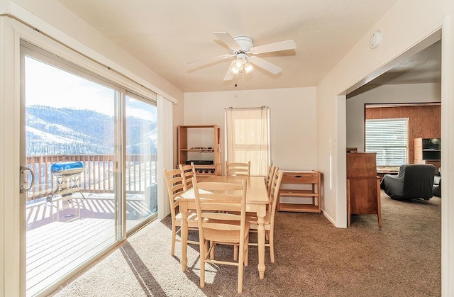 dining area featuring carpet flooring and ceiling fan