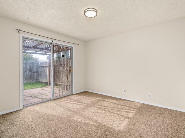 2103 N Price Ave Unit 106, Fresno, CA 93703 - carpeted spare room with a textured ceiling and baseboards
