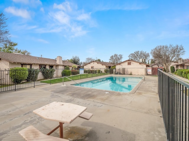 2103 N Price Ave Unit 106, Fresno, CA 93703 - community pool with fence, a residential view, and a patio