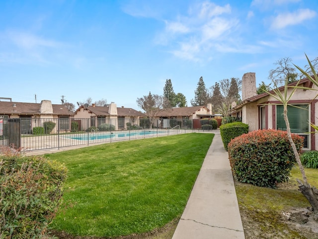 2103 N Price Ave Unit 106, Fresno, CA 93703 - view of yard featuring a community pool