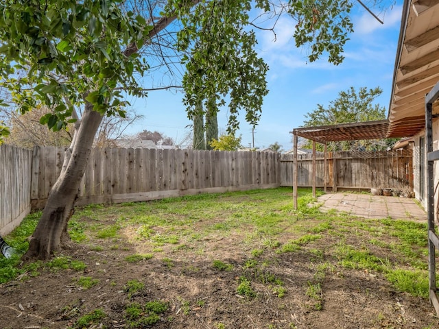 2103 N Price Ave Unit 106, Fresno, CA 93703 - fenced backyard with a patio area