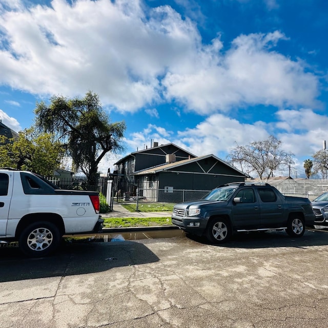 view of car parking with fence