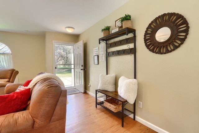 entryway featuring light wood-style flooring and baseboards