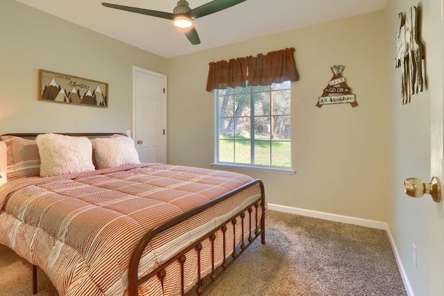 carpeted bedroom featuring ceiling fan and baseboards