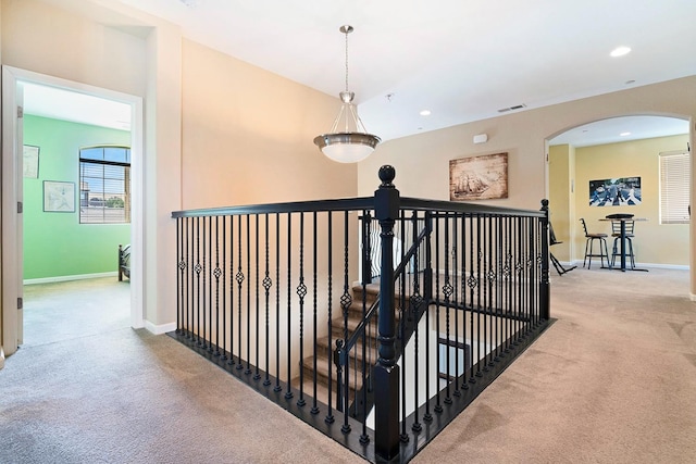 hall featuring carpet floors, recessed lighting, an upstairs landing, and baseboards