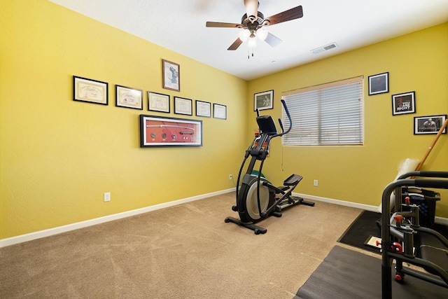 exercise room featuring baseboards, visible vents, ceiling fan, and carpet flooring