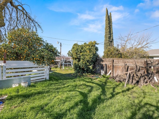 view of yard featuring fence