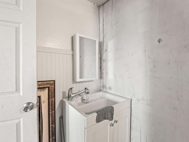 bathroom with wainscoting and vanity