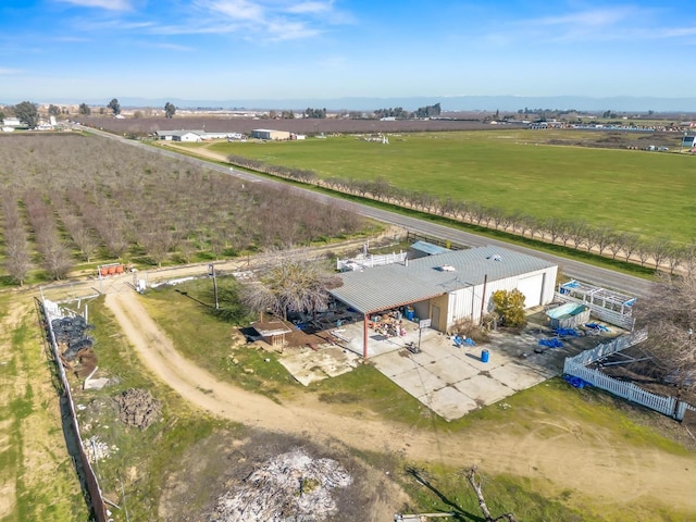 birds eye view of property with a rural view