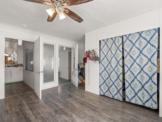 unfurnished room featuring ceiling fan and wood finished floors