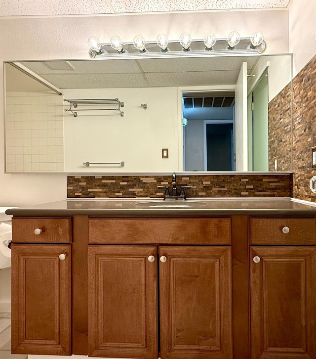 bathroom featuring backsplash and vanity