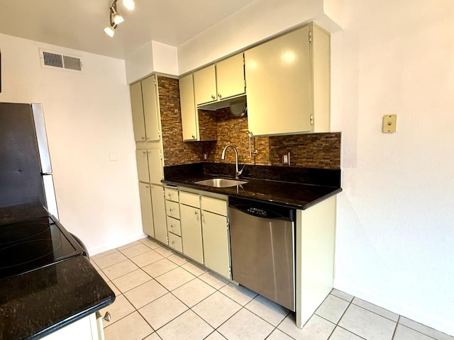 kitchen with light tile patterned floors, visible vents, freestanding refrigerator, a sink, and dishwasher