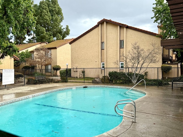 pool featuring fence