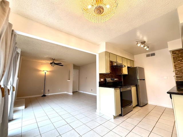 kitchen featuring light tile patterned flooring, range with electric stovetop, visible vents, backsplash, and dark countertops