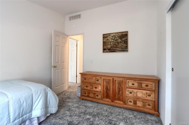 bedroom with light carpet and visible vents