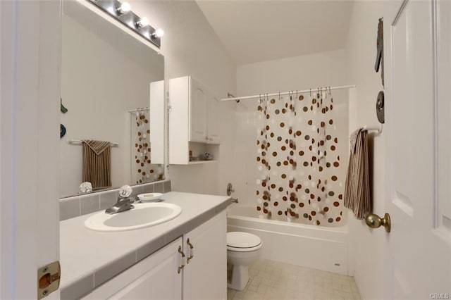 bathroom featuring toilet, shower / tub combo, and vanity