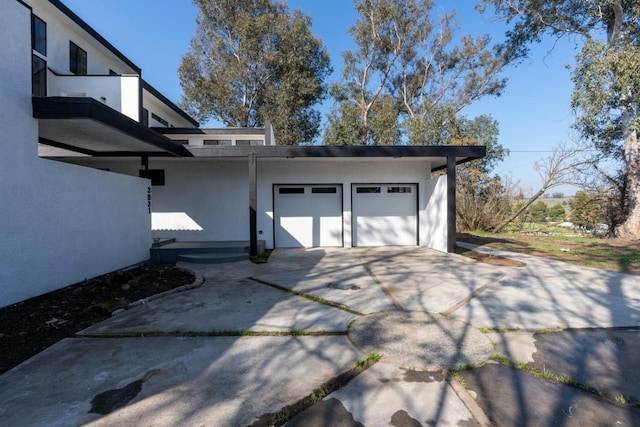 garage featuring driveway