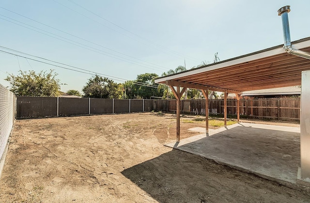 view of yard with a fenced backyard and a patio