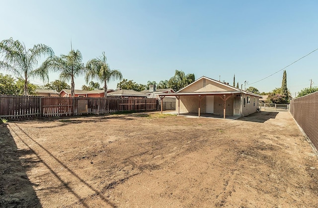 view of yard featuring a patio area and a fenced backyard