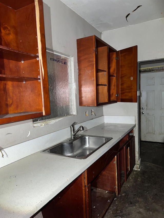 kitchen featuring light countertops and a sink