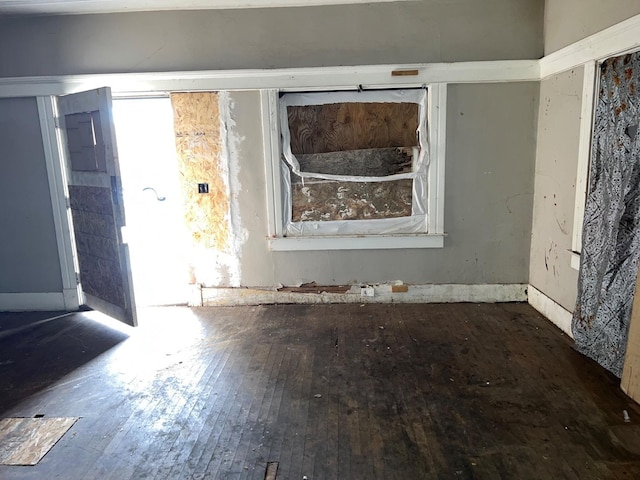 empty room with hardwood / wood-style flooring