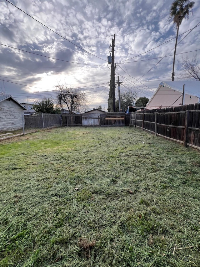 view of yard with a fenced backyard