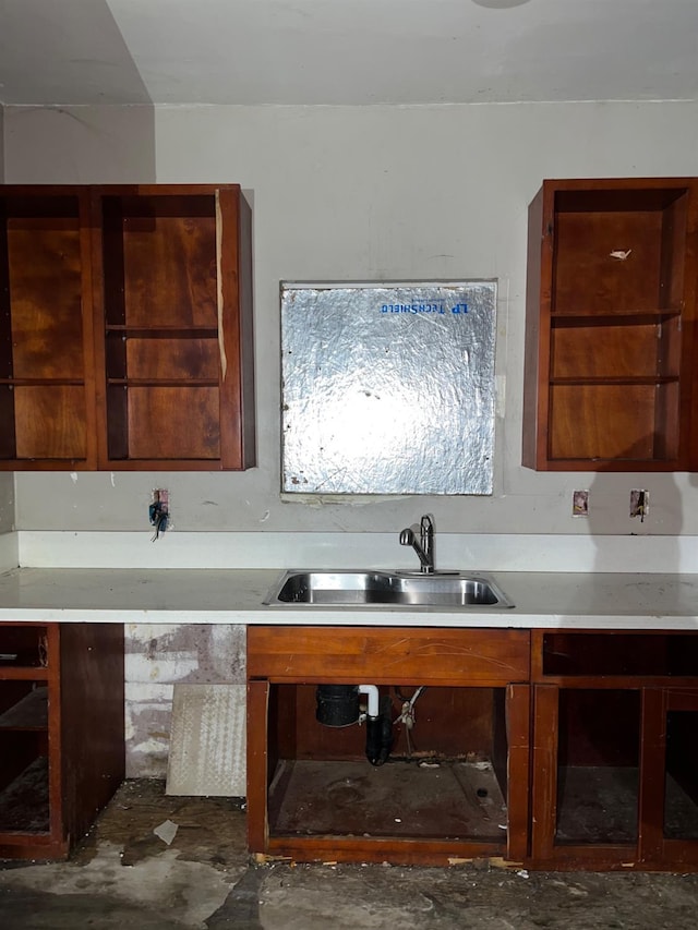 kitchen featuring light countertops and a sink