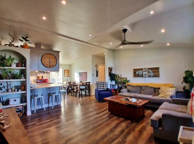 living room featuring ceiling fan, vaulted ceiling, dark wood finished floors, and recessed lighting