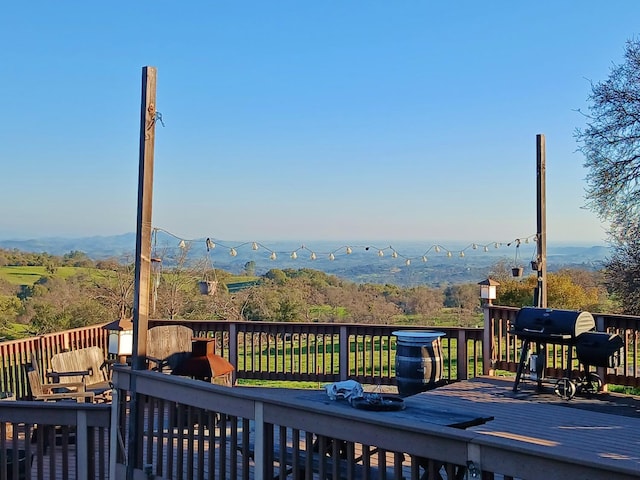 deck featuring a grill