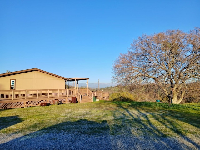 view of yard featuring a wooden deck