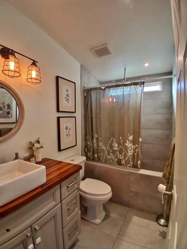 full bath with visible vents, toilet, tile patterned floors, a combined bath / shower with rainfall shower, and vanity