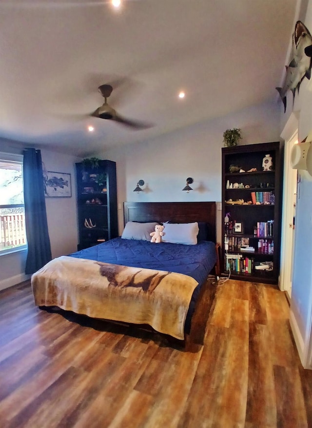 bedroom featuring recessed lighting, ceiling fan, vaulted ceiling, wood finished floors, and baseboards