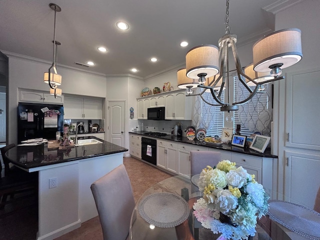 kitchen with recessed lighting, a sink, ornamental molding, decorative backsplash, and black appliances